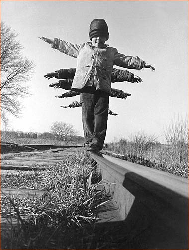 Children balance on rail in South Dakota.